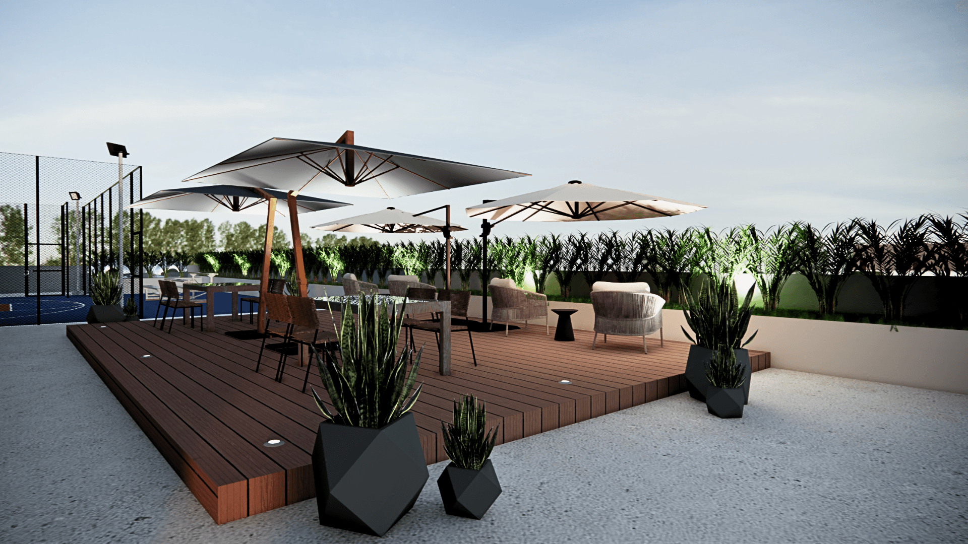 The roofdeck lounge with timber decking, lounge seating, and parasols at dusk.